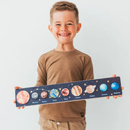 Image of a boy playing with a beautiful Montessori educational puzzle set